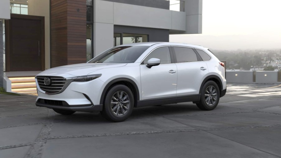 A white 2022 Mazda CX-9 midsize SUV is parked.
