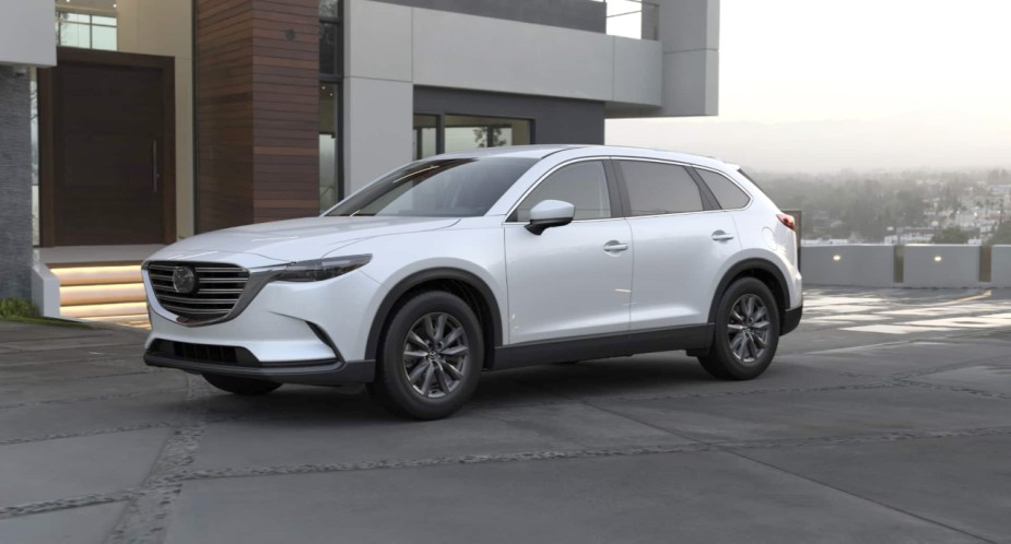 A white 2022 Mazda CX-9 mid-size SUV is parked.