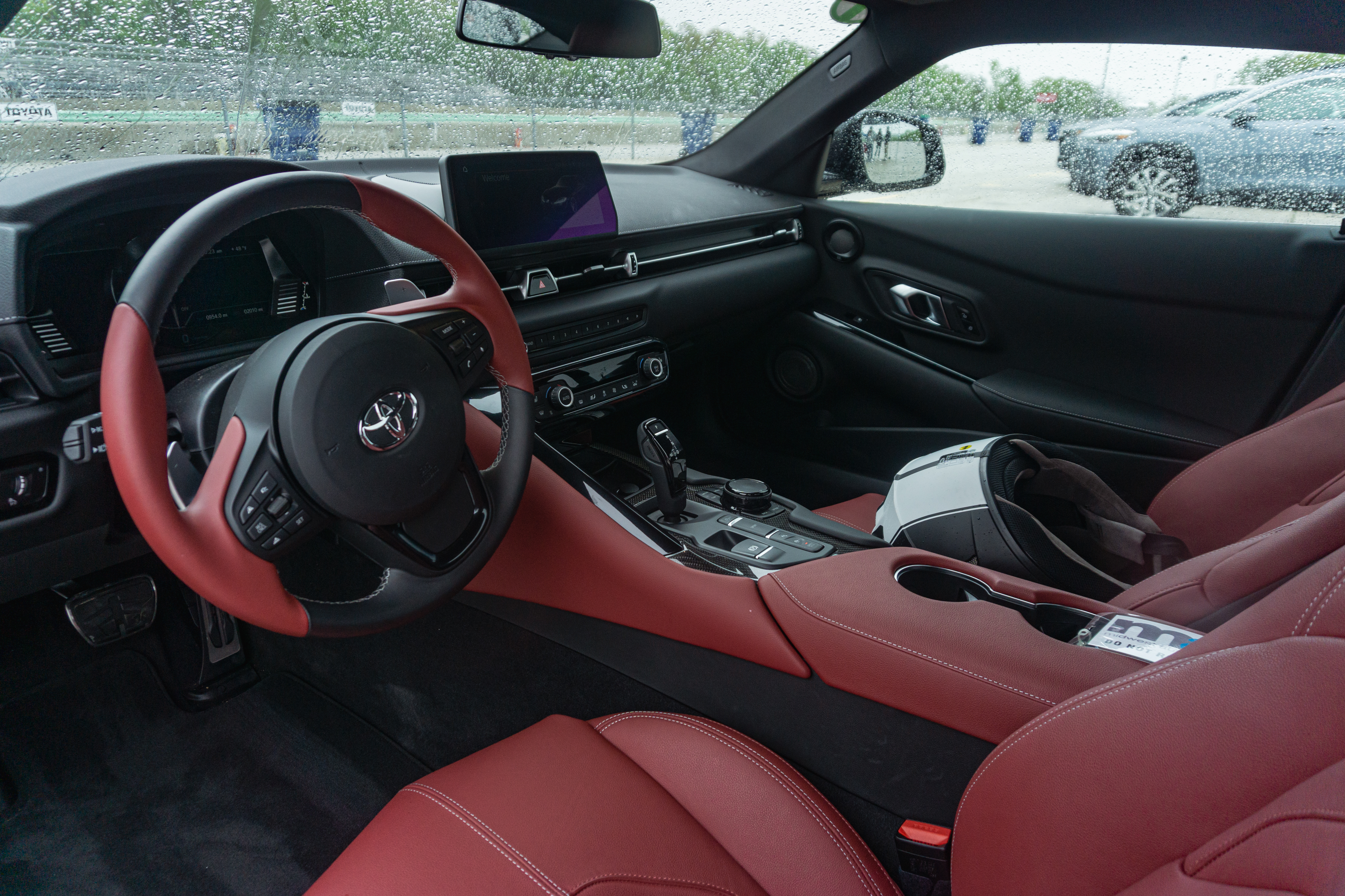 The red-leather seats and black dashboard of a 2022 Toyota GR Supra 3.0 Premium