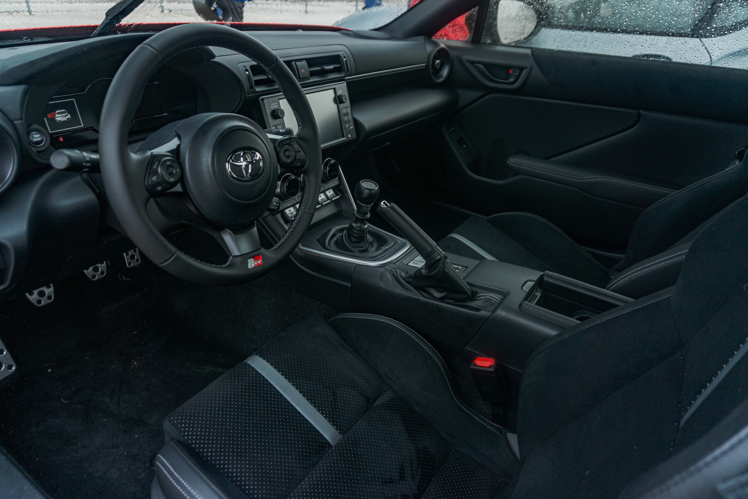 The black front seats and dashboard of a 2022 Toyota GR86 Premium