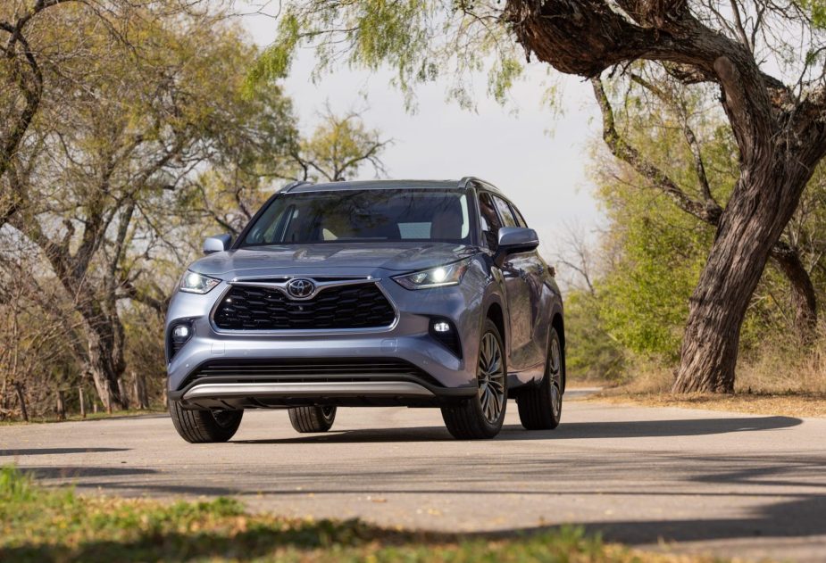 A silver 2022 Toyota Highlander parked in the wilderness, here's why you should wait for the new model year.