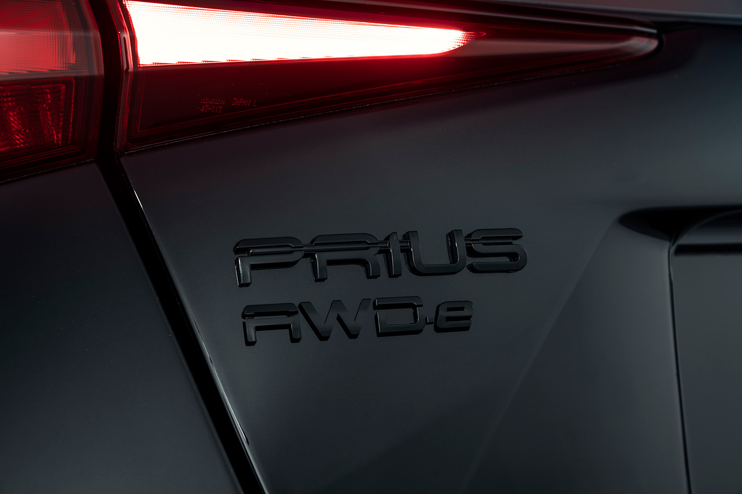 2022 Toyota Prius XLE AWD-e badge on nightshade model all wheel drive car