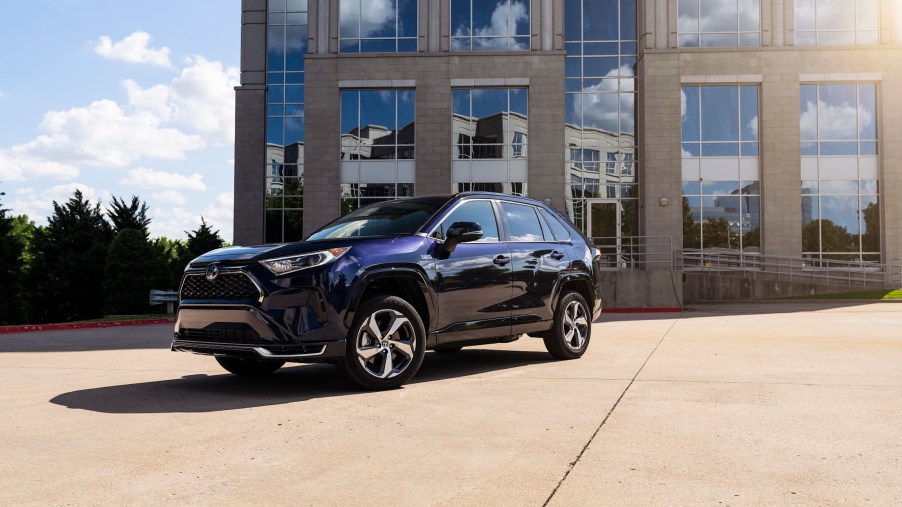A 2022 Toyota RAV4 Prime small SUV parked in front of a building