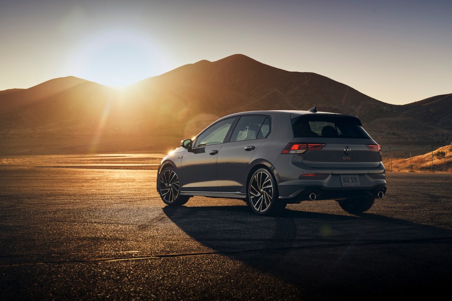 A rear view of the 2022 Volkswagen GTI in the middle of the desert.