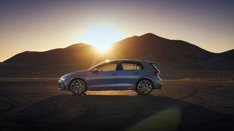 The 2022 Volkswagen GTI side view in the middle of a desert.