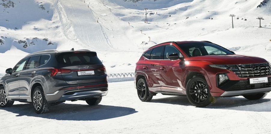 two 2022 Hyundai Santa Fe SUVs in the snow