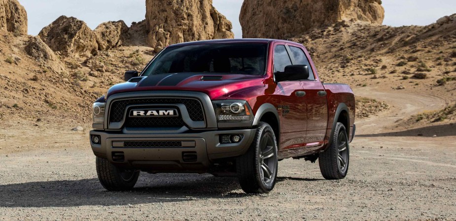 A red 2022 Ram 1500 Classic Warlock sits in the desert.