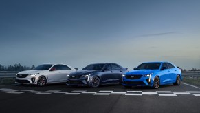 A white, black, and blue 2023 Cadillac CT4-V Blackwing Track Edition on a racetrack
