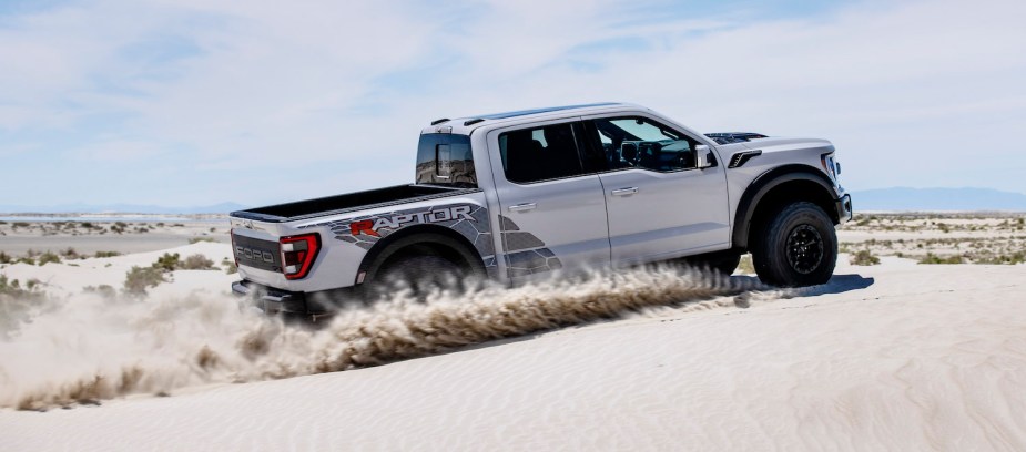 Ford F-150 Raptor R Driving across sand dunes