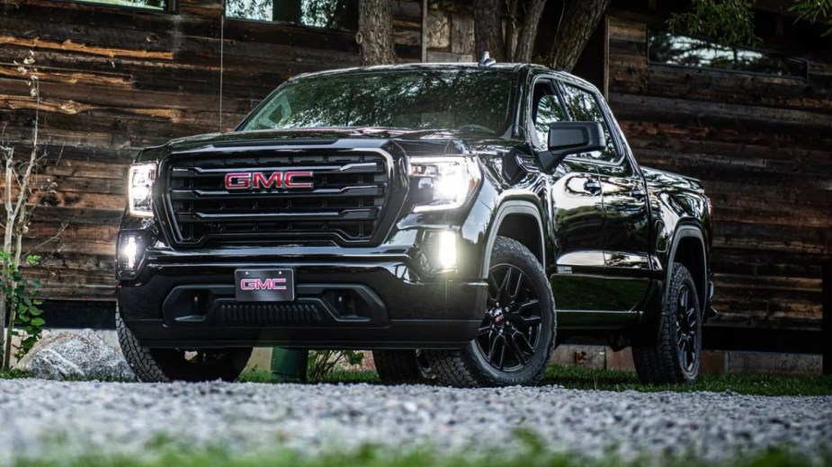 2023 GMC Sierra 1500 Exterior in black parked next to a house