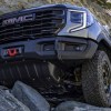 This 2023 GMC Sierra AT4X AEV is crawling over rocks, showing off what an off-road truck should do
