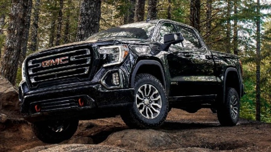 A Black 2023 GMC Sierra AT4X in the woods