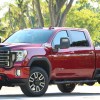 A Red 2023 GMC Sierra HD AT4 truck posed