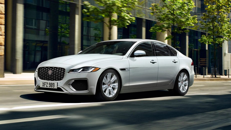 A white 2023 Jaguar XF P250 S driving in the city