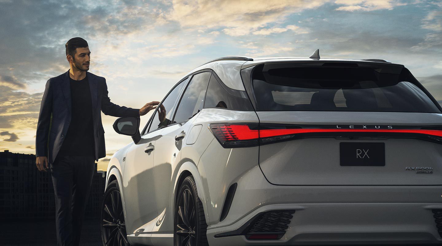 2023 Lexus RX in white with a male model