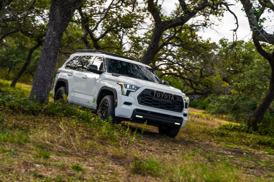 Promo photo of a white Toyota Sequoia TRD Pro 4x4 SUV with a hybrid engine.
