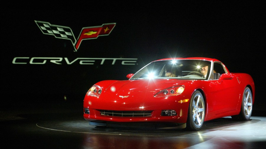 A red 2005 C6 Chevrolet Corvette on stage at NAIAS 2004