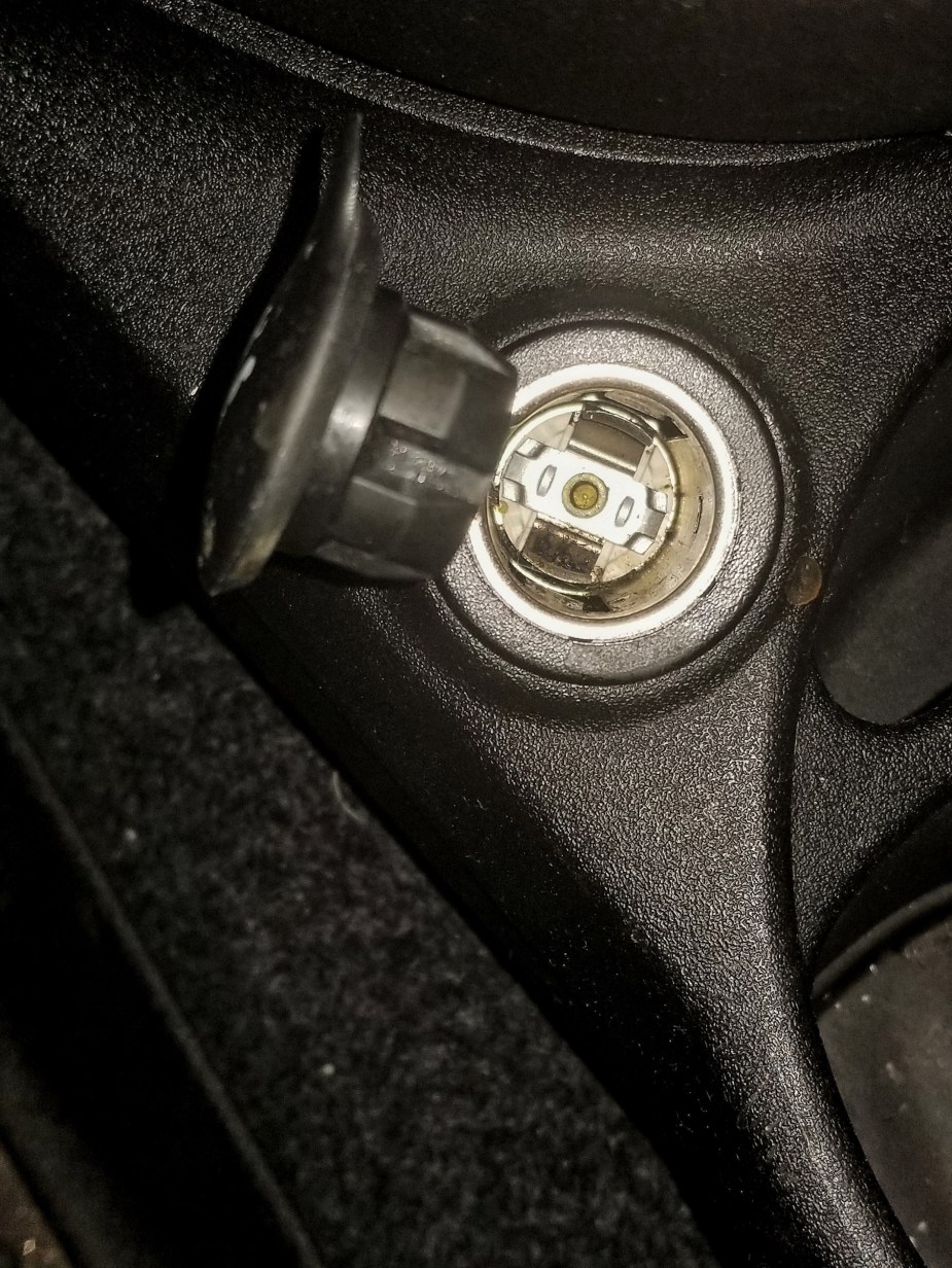 The 12-volt car power outlet socket in a 2013 Fiat 500 Abarth