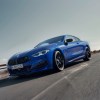 A blue BMW M850i xDrive Coupé on the highway