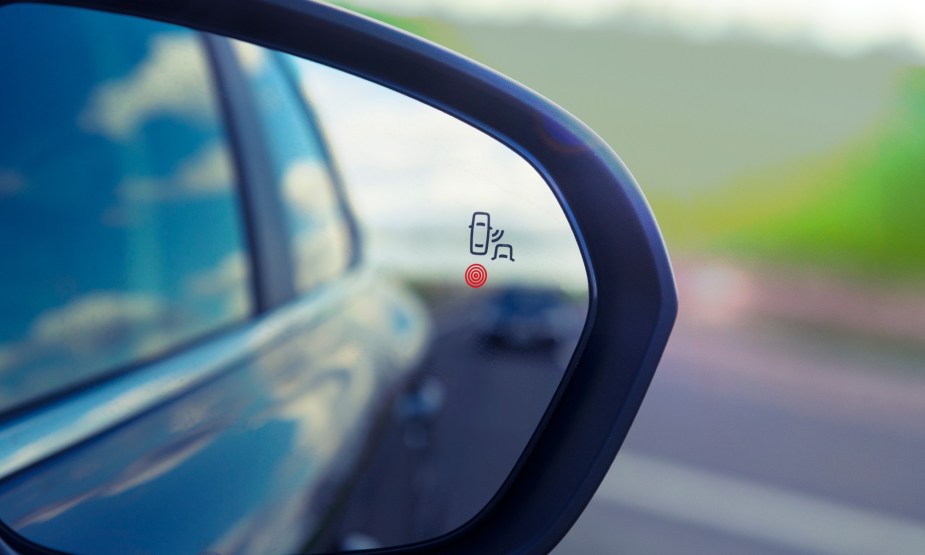 Blind-Spot Monitoring Warning Indicator alerts a driver to a vehicle in their blind area
