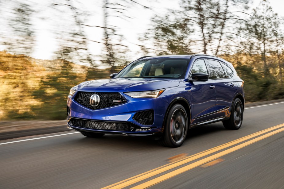 Blue 2022 Acura MDX Driving on the road