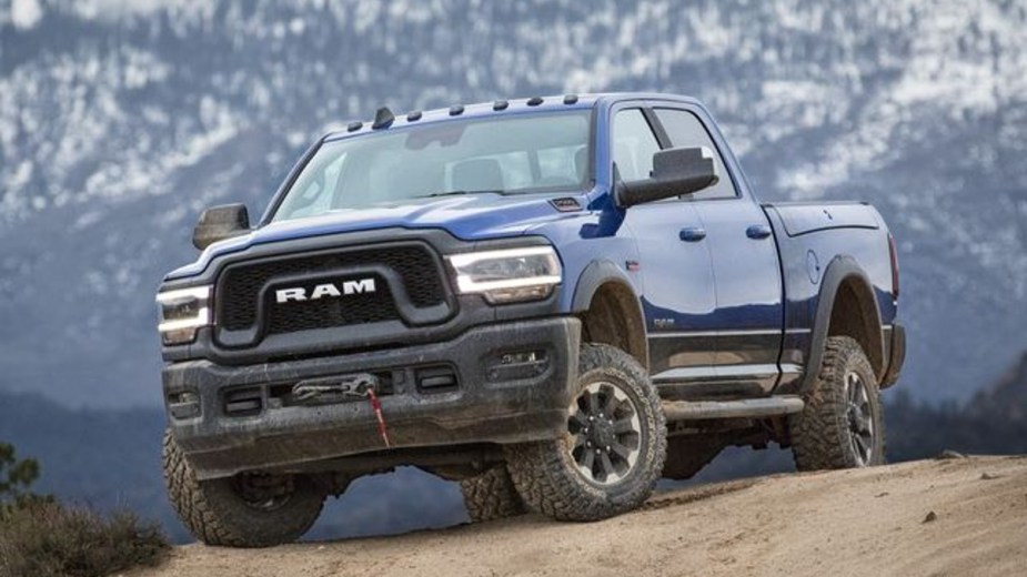 A Blue 2022 Ram 2500 HD sitting on top of a hill