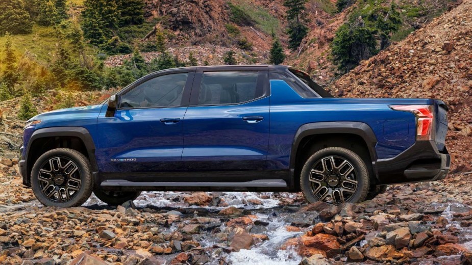 Blue Chevy Electric Truck, this is the 2024 Chevrolet Silverado EV RST crossing a creek bed
