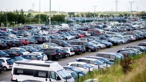 Vehicles in a parking lot with VINs, which you can detect fraud using your VIN.