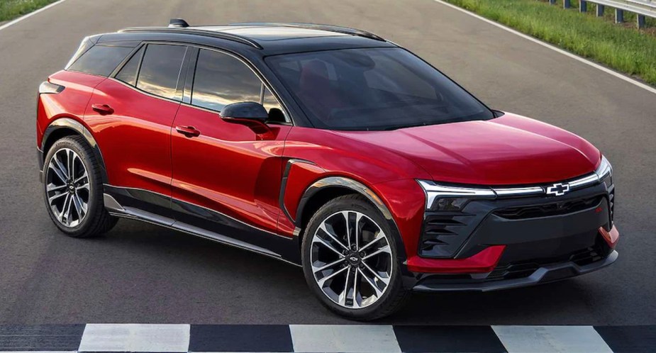 A red 2024 Chevy Blazer EV electric SUV is parked.