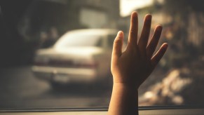 Child's Hand on a Car Window might be a signal of a child on the brink of death