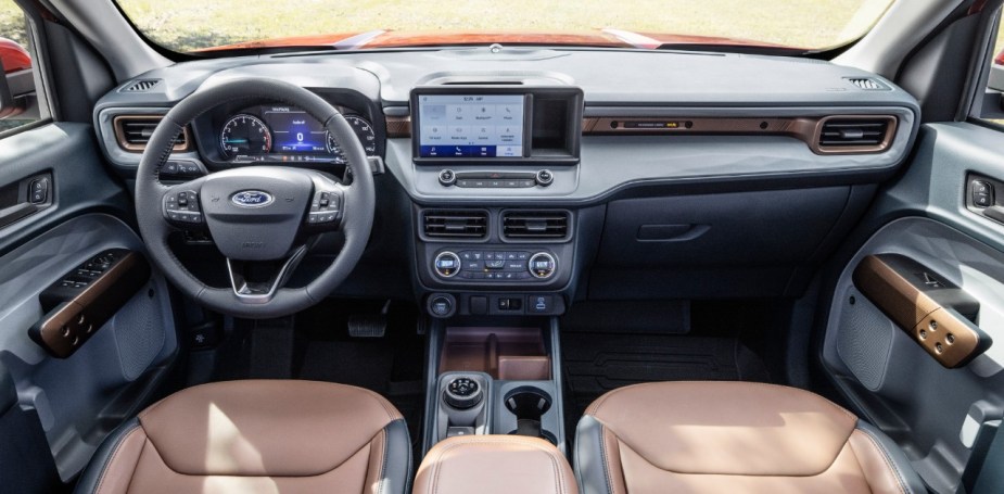 Dashboard and front seats in 2023 Ford Maverick pickup truck, highlighting its release date and price