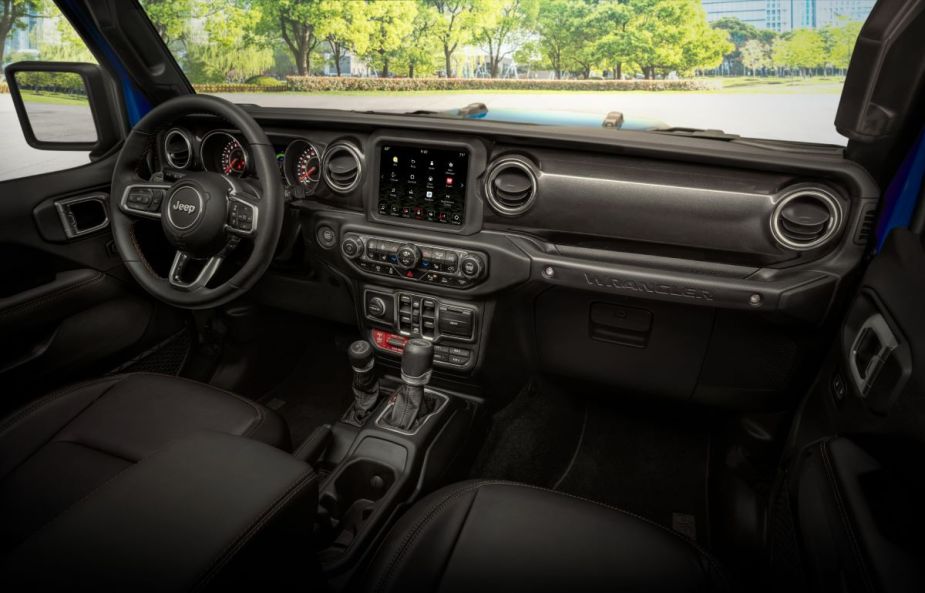 Dashboard and front seats in 2023 Jeep Wrangler, highlighting its release date and price