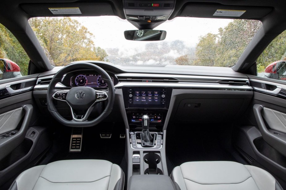 Dashboard and front seats in 2023 Volkswagen Arteon midsize sedan, highlighting its release date and price