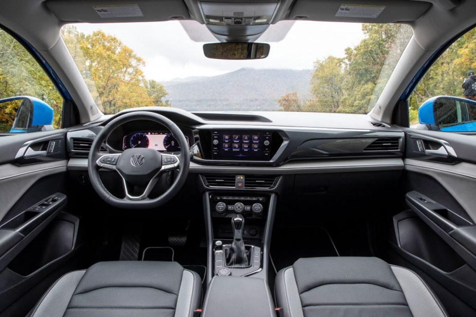 Dashboard and front seats in 2023 Volkswagen Taos, highlighing its release date and price