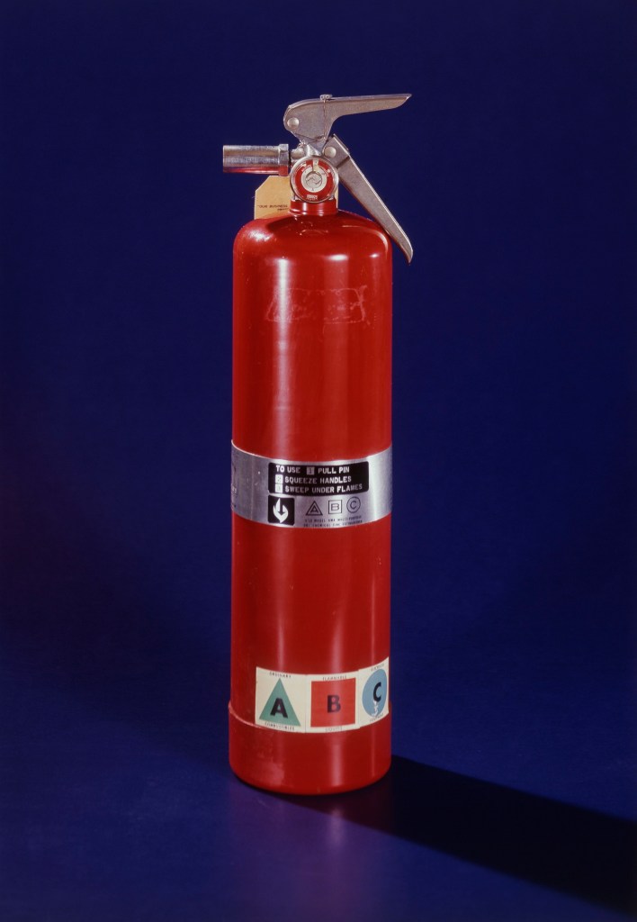 A fire extinguisher is one of the implements that firefighters recommend you keep in your car. 