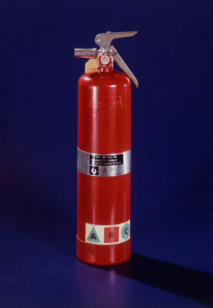 A fire extinguisher is one of the implements that firefighters recommend you keep in your car.