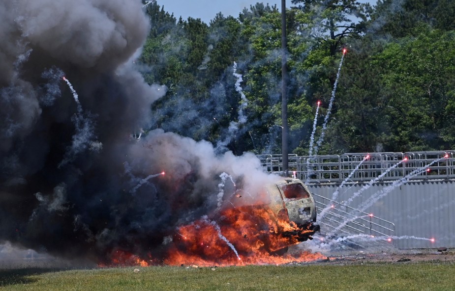 Firefighters deliberately set off illegal Fourth of July fireworks in a car on a track