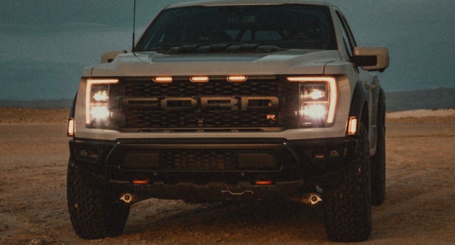A gray 2023 Ford F-150 Raptor R off-road pickup truck is parked. 