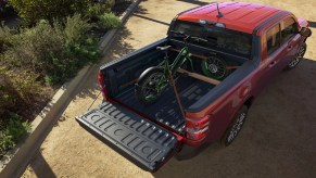 A green bike is packed into the 2022 Ford Maverick's flexbed.