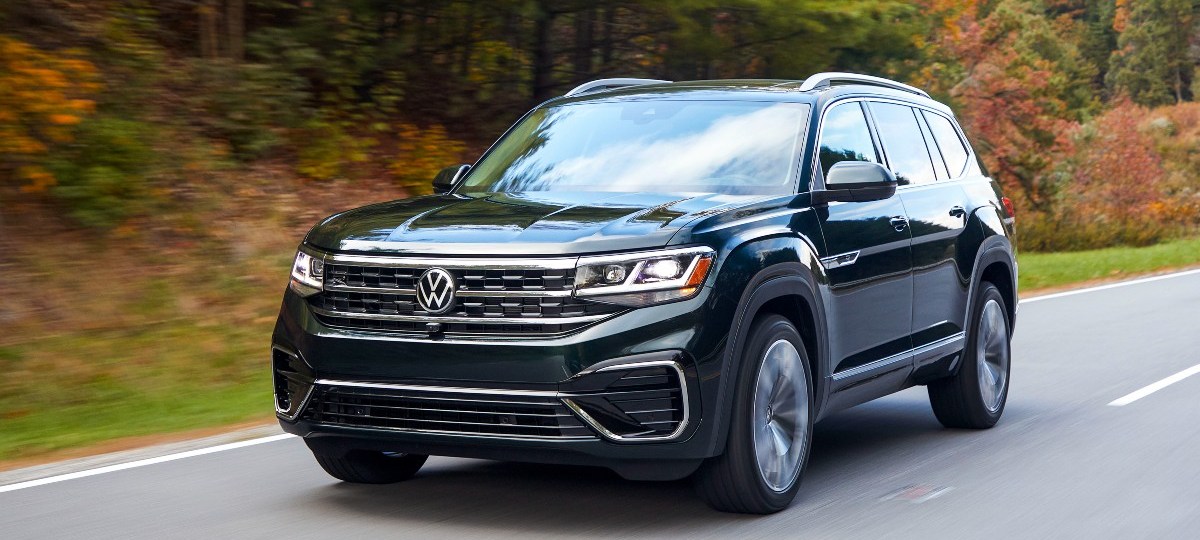 Front angle view of Tourmaline Blue Metallic 2023 Volkswagen Atlas midsize SUV, highlighting its release date and price