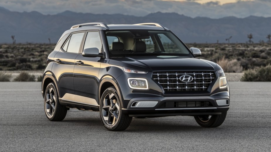 Front angle view of dark gray 2023 Hyundai Venue crossover SUV, highlighting its release date and price