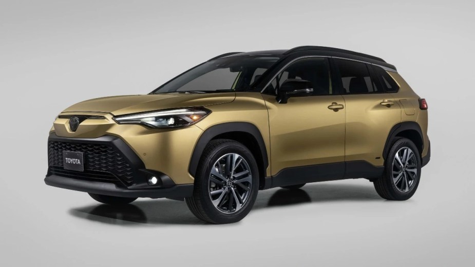 Front angle view of the gold 2023 Toyota Corolla Cross