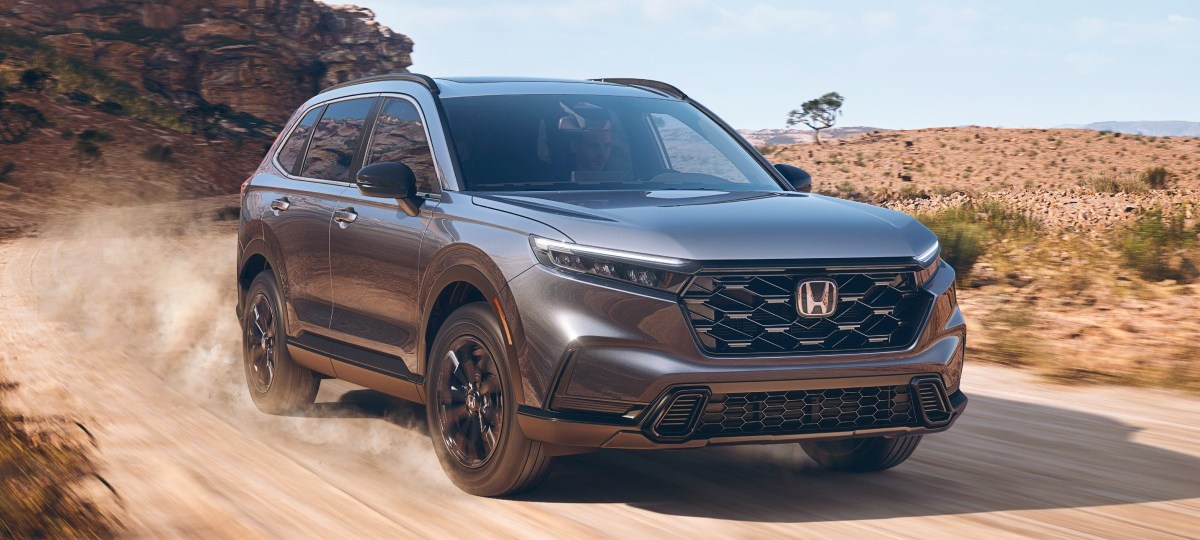 Front angle view of gray 2023 Honda CR-V crossover SUV, highlighting its release date and price