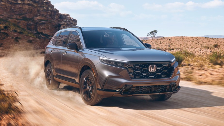 Front angle view of gray 2023 Honda CR-V crossover SUV, highlighting its release date and price