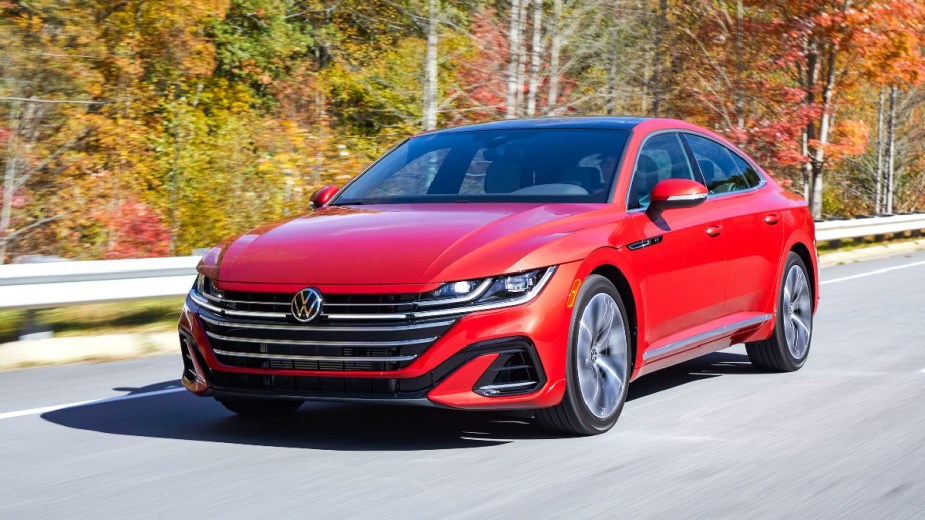 Front angle view of red 2023 Volkswagen Arteon midsize sedan, highlighting its release date and price