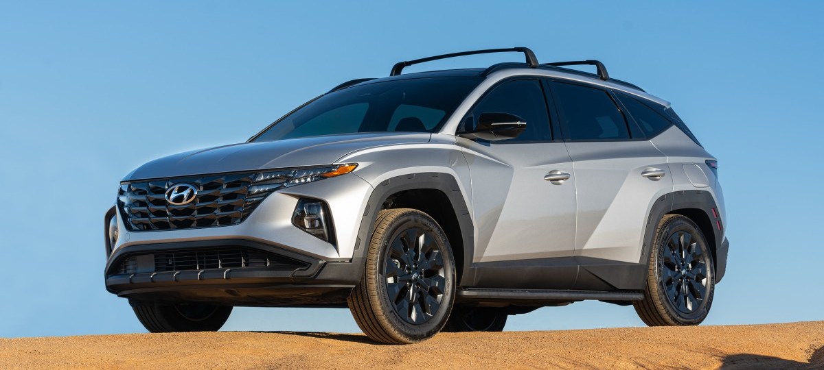 Front angle view of silver 2023 Hyundai Tucson, highlighting its release date and price