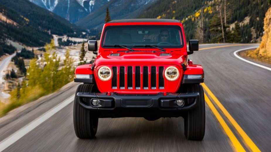 Front view of red 2023 Jeep Wrangler SUV, highlighting its release date and price