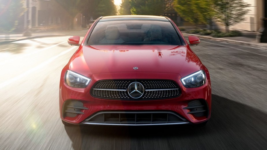 Front view of red 2023 Mercedes-Benz E-Class midsize luxury car, highlighting its release date and price