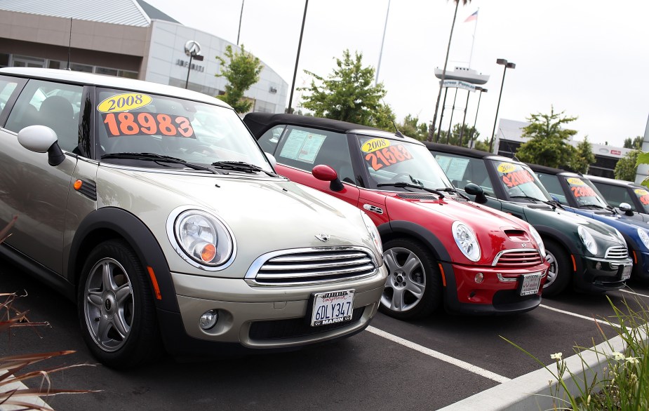 used car dealership displaying a host of mini coopers for sale 