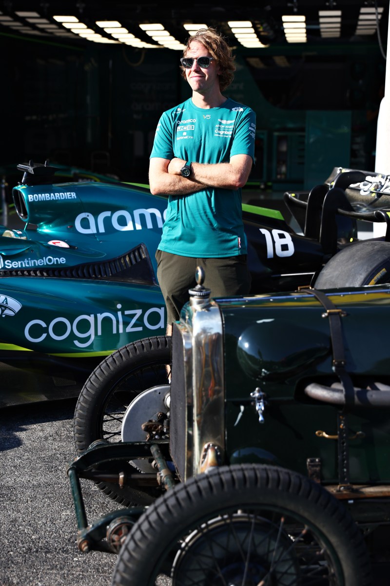 Sebastian Vettel with his F1 race car and a vintage Mercedes. 